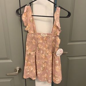 Cute tank top from francesca’s. Never worn, still has tag on it. Size medium.